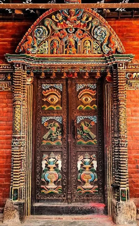 Intricately carved wooden doors in a temple in Kathmandu, Nepal